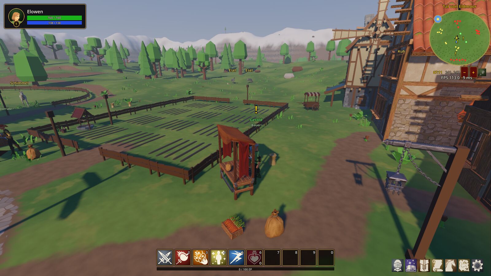 Farm fields with fences, a well and the village behind
